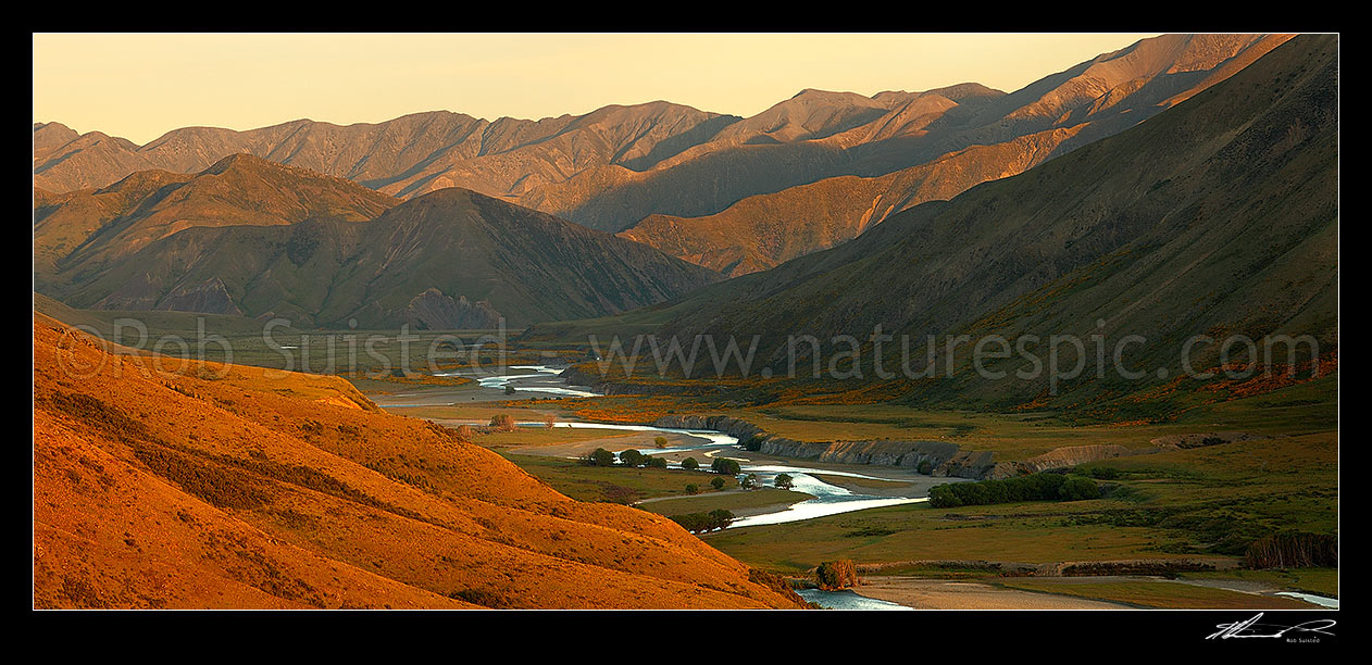 Image of Evening light over the Clarence River from Acheron, with Bullen Hills (left) and Amuri and Seaward Kaikoura Ranges behind. Panorama, Molesworth Station, Marlborough District, Marlborough Region, New Zealand (NZ) stock photo image