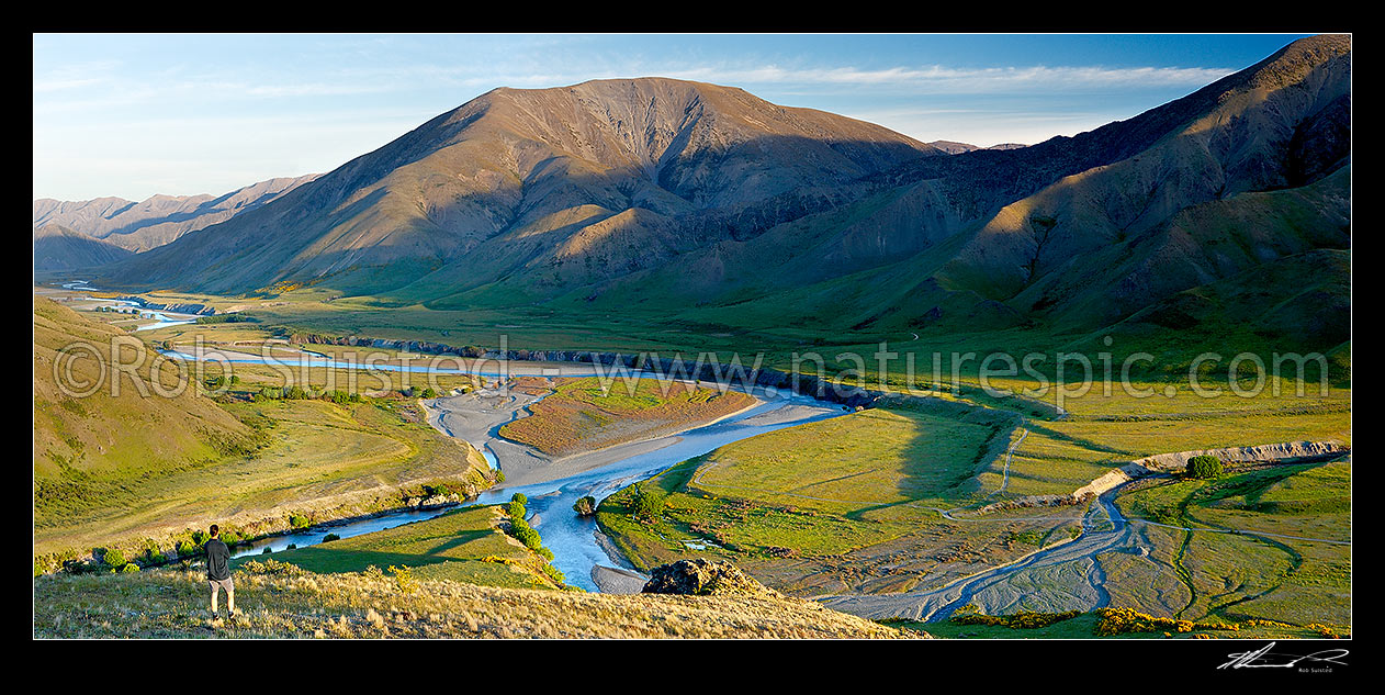 Image of Clarence River and Acheron River (left) confluence panonrama, with visitor admiring view. Lush summer growth, Molesworth Station, Marlborough District, Marlborough Region, New Zealand (NZ) stock photo image