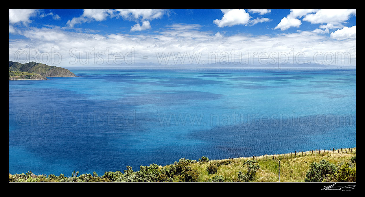 Image of Cloud patterns on Cook Strait. Ohau Point at left, South Island, Marlborough Sounds and The Brothers (right) in distance. Summer panorama from above Opau Bay, Makara Beach, Wellington City District, Wellington Region, New Zealand (NZ) stock photo image