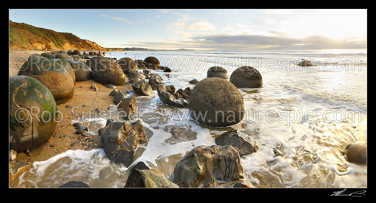 Image of Moeraki Boulders / Kaihinaki, 60 Million year old mudstone concretions in waves. A well known tourist destination. Panorama, Moeraki, Waitaki District, Canterbury Region, New Zealand (NZ) stock photo image