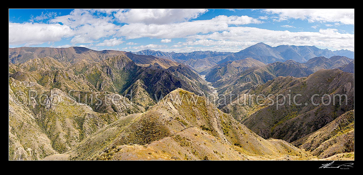 Image of Clarence Reserve, from Blind Saddle down Seymour Stream towards the Clarence River. Inland Kaikouras and St Bernard (2256m right) beyond. Split Rock stream left. Panorama, Clarence Reserve, Kaikoura District, Canterbury Region, New Zealand (NZ) stock photo image