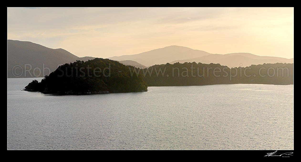 Image of Paterson Inlet, with Prices Point centre looking towards Freshwater River at dusk. Rakiura National Park. Panorama, Paterson Inlet / Whaka a Te Wera, Stewart Island District, Southland Region, New Zealand (NZ) stock photo image