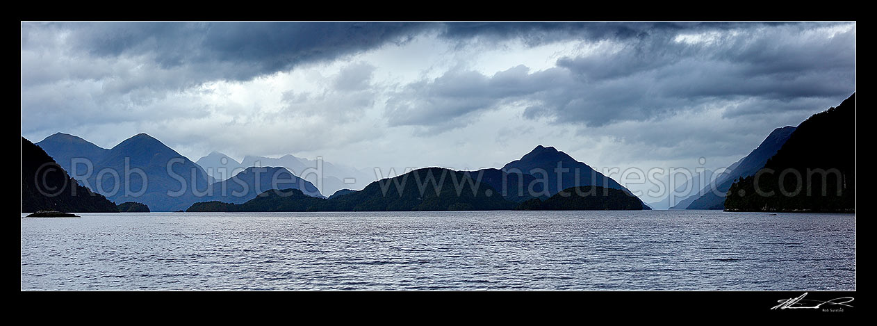 Image of Dusky Sound moody panorama. Resolution Island left, Long Island centre, Cook Channel right, taken from Pickersgil Harbour, Dusky Sound, Fiordland National Park, Southland District, Southland Region, New Zealand (NZ) stock photo image