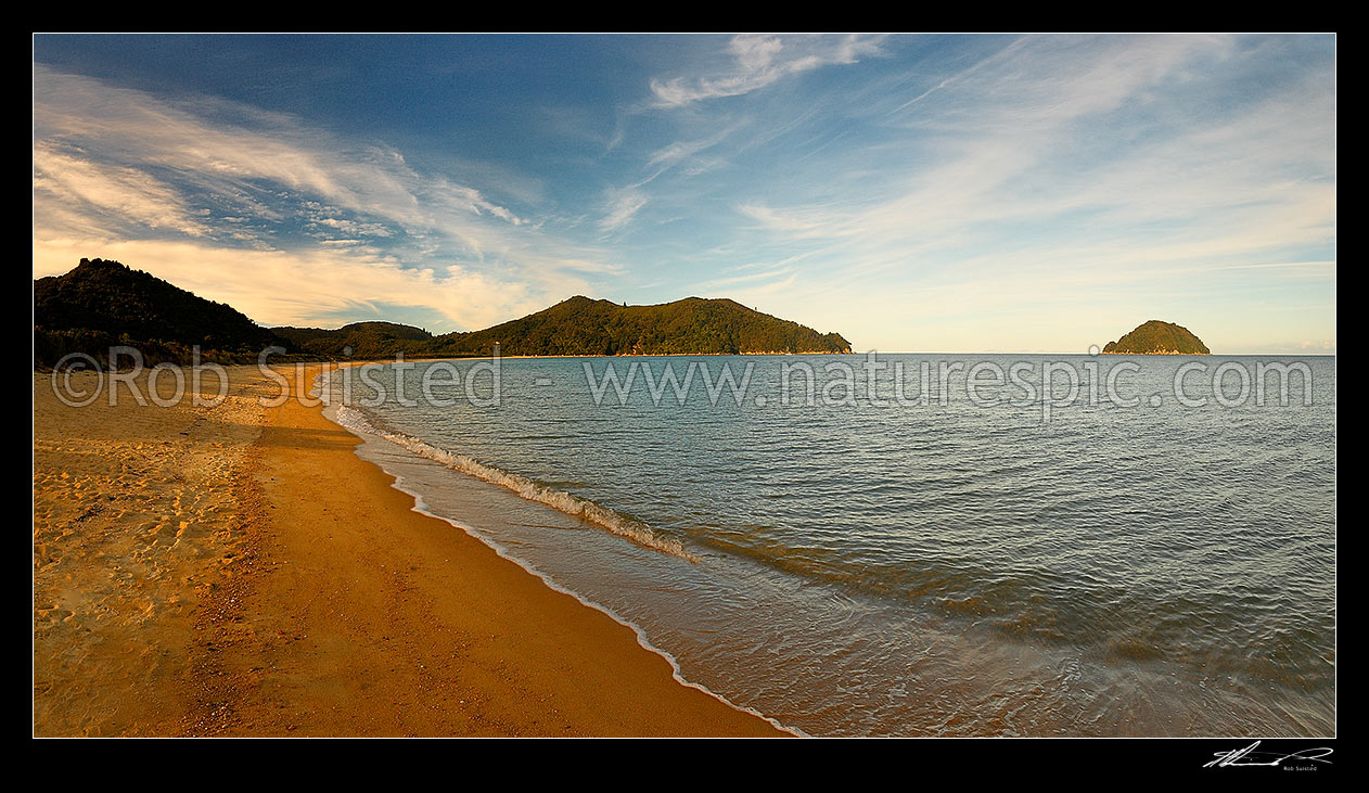 Image of Golden sand on Onetahuti Beach, Abel Tasman Great Walk track. Evening panorama with Tonga Island at right, Abel Tasman National Park, Tasman District, Tasman Region, New Zealand (NZ) stock photo image