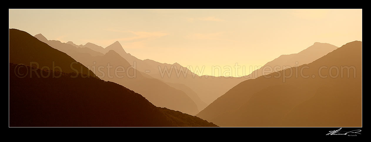 Image of Fiordland wilderness silhouette ridgelines in George Sound. Taken from Edith-Wapiti River Saddle. Expedition Peak at left. Panorama, Edith River, Fiordland National Park, Southland District, Southland Region, New Zealand (NZ) stock photo image