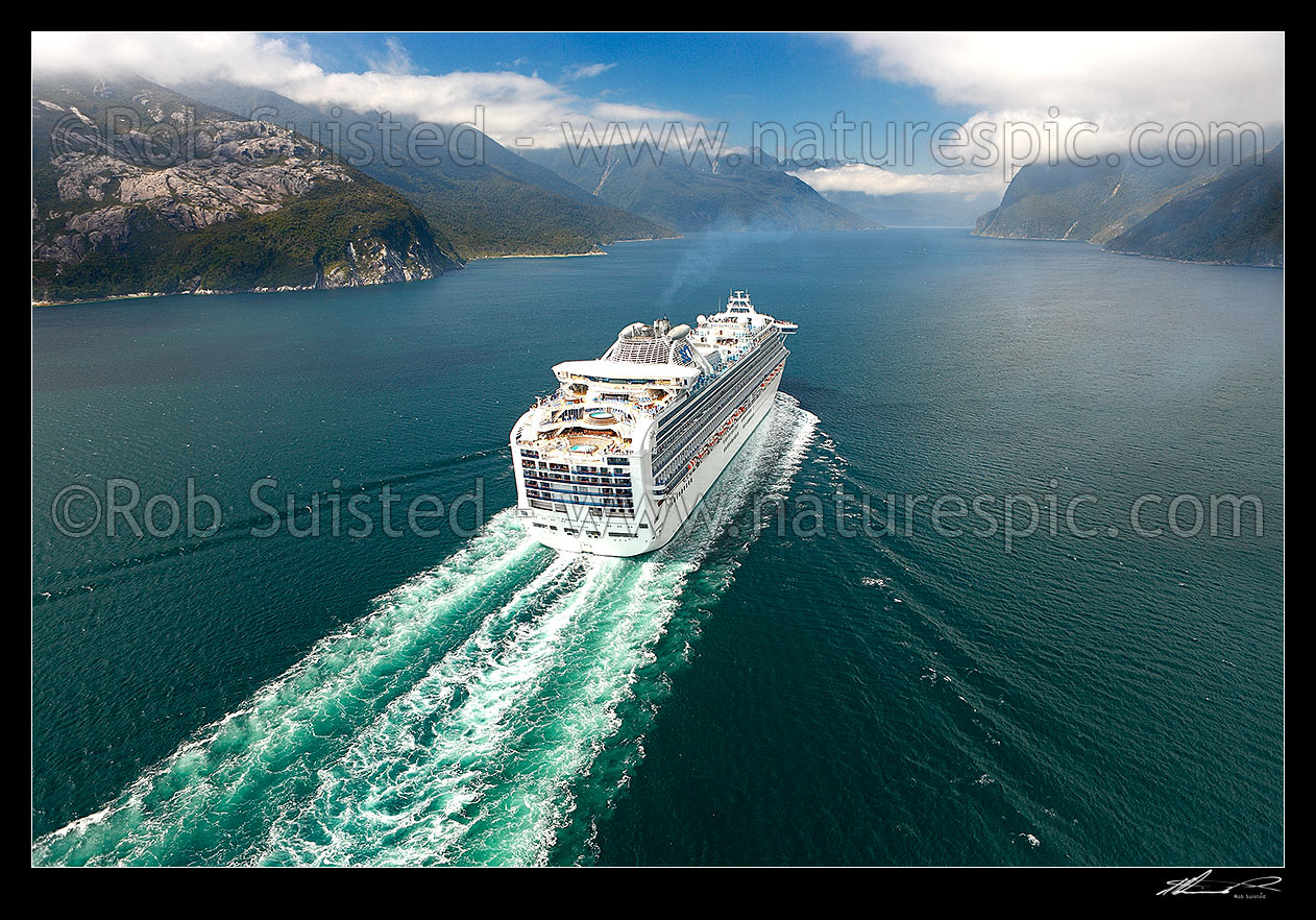 Image of Cruise ship in Thompson Sound, sailing towards Doubtful Sound. Princess Cruises Diamond Princess vessel with Secretary Island right. Aerial, Thompson Sound, Fiordland National Park, Southland District, Southland Region, New Zealand (NZ) stock photo image