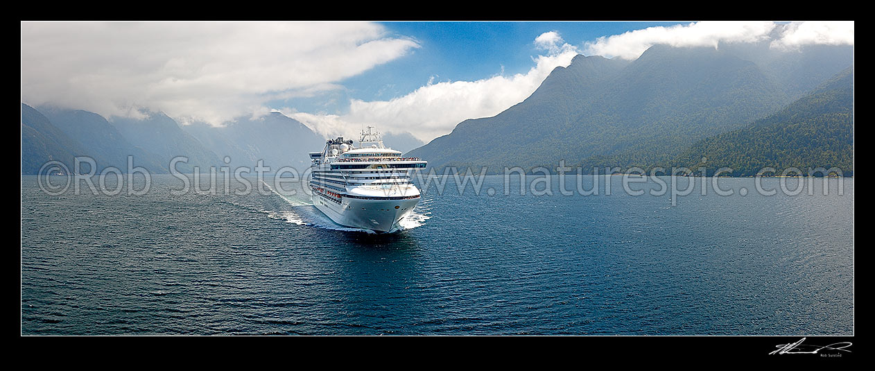 Image of Princess Cruises Diamond Princess cruise ship in Thompson Sound enroute to Doubtful Sound. Secretary Island behind left. Aerial panorama, Thompson Sound, Fiordland National Park, Southland District, Southland Region, New Zealand (NZ) stock photo image