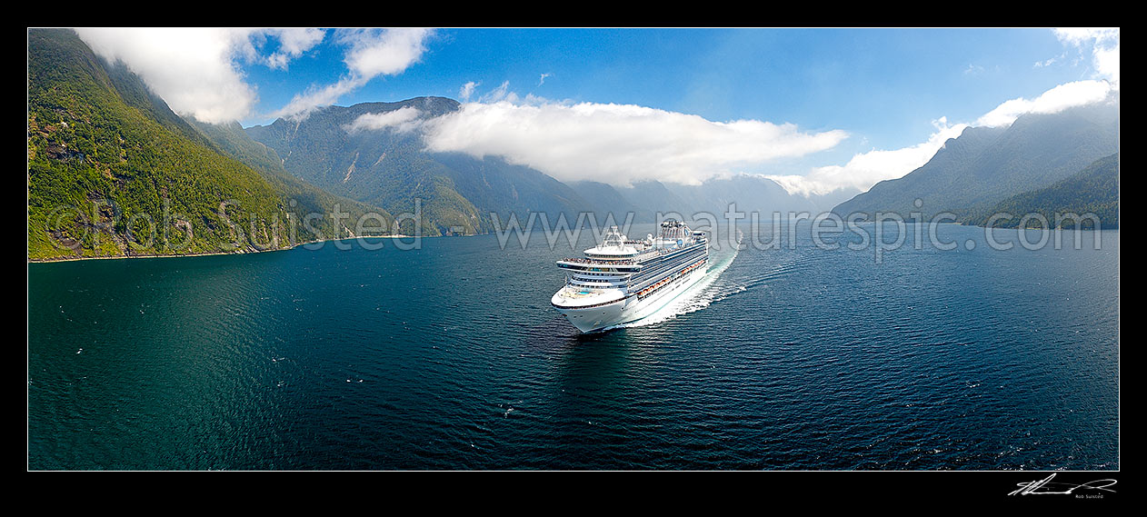 Image of Princess Cruises Diamond Princess cruise ship in Thompson Sound enroute to Doubtful Sound. Secretary Island with Hub Creek and Lieutenant Head left. Aerial panorama. Hu, Thompson Sound, Fiordland National Park, Southland District, Southland Region, New Zealand (NZ) stock photo image