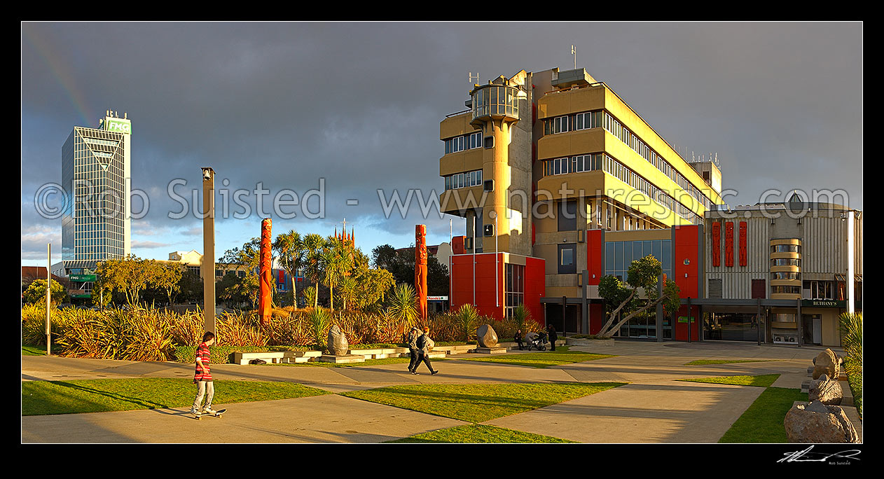 Image of Palmerston North City Council building in The Square, with large Maori carvings in the gardens. Panorama, Palmerston North, Palmerston North City District, Manawatu-Wanganui Region, New Zealand (NZ) stock photo image