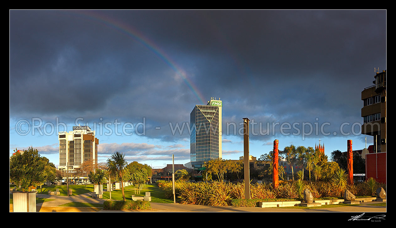 Image of FMG building with rainbow, seen from The Square in Palmerston North city centre (Farmers Mutual Group). Panorama, Palmerston North, Palmerston North City District, Manawatu-Wanganui Region, New Zealand (NZ) stock photo image