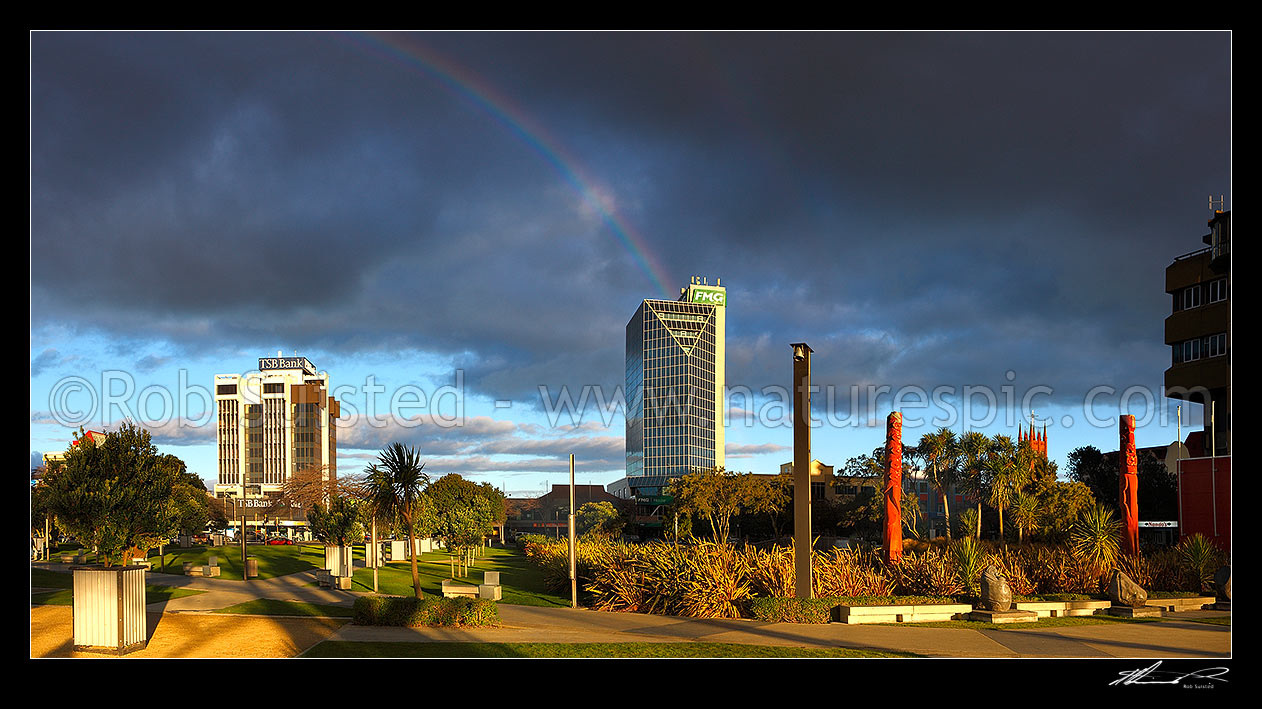 Image of FMG building with rainbow, seen from The Square in Palmerston North city centre (Farmers Mutual Group). Panorama, Palmerston North, Palmerston North City District, Manawatu-Wanganui Region, New Zealand (NZ) stock photo image