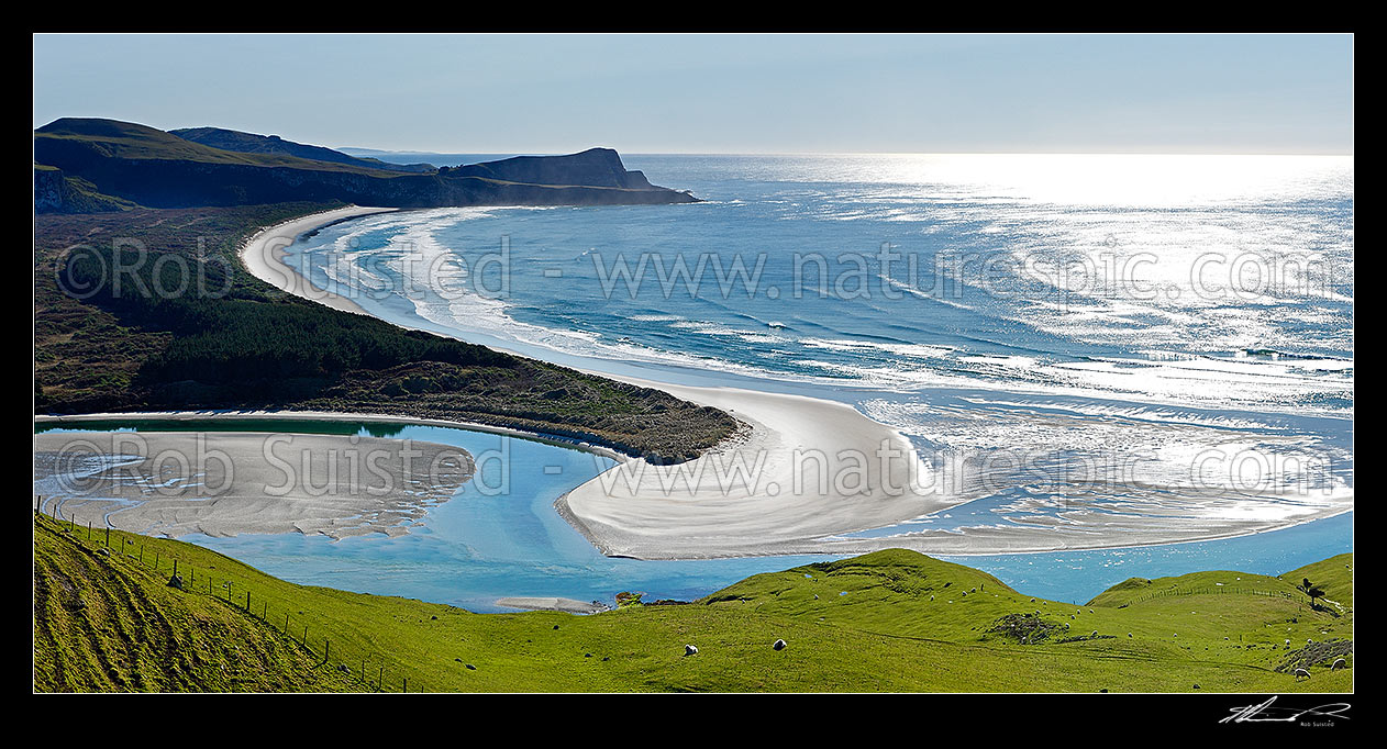 Image of Looking across farmland to Okia Flat, Victory Beach and Wickliffe Bay to Te Whakarekaiwi Point. Papanui Inlet centre left. Panorama, Otago Peninsula, Dunedin City District, Otago Region, New Zealand (NZ) stock photo image