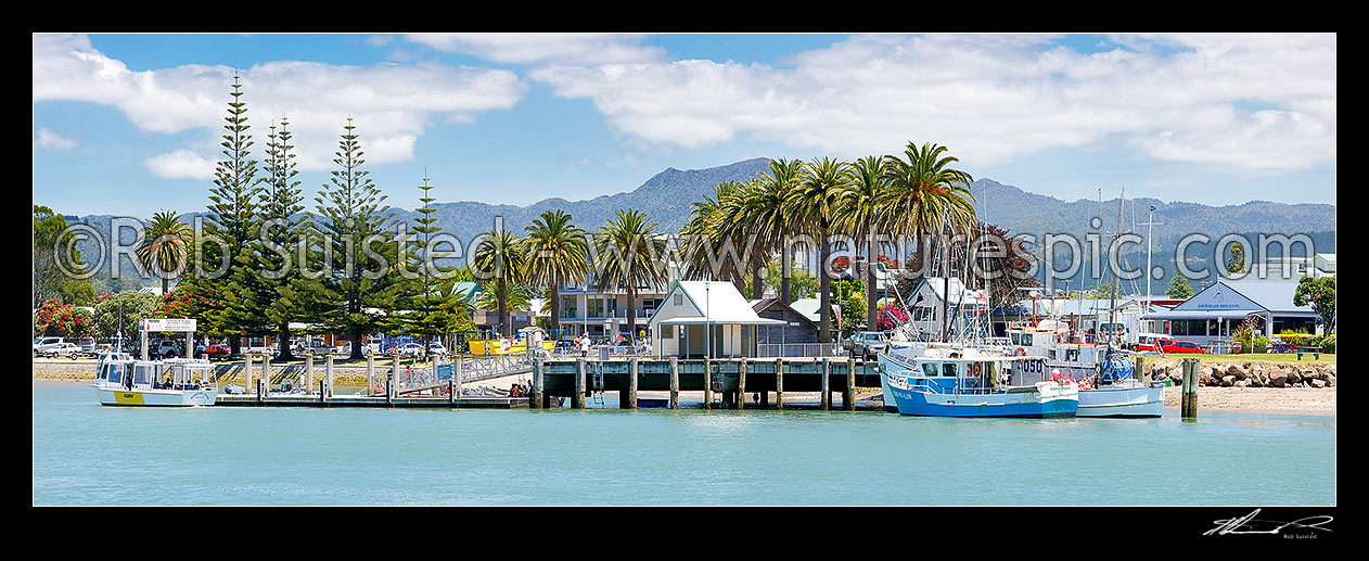 Image of Whitianga foreshore with fishing boats and the ferry alongside the Esplanade beside the Harbour entrance. Panorama, Whitianga, Coromandel Peninsula, Thames-Coromandel District, Waikato Region, New Zealand (NZ) stock photo image