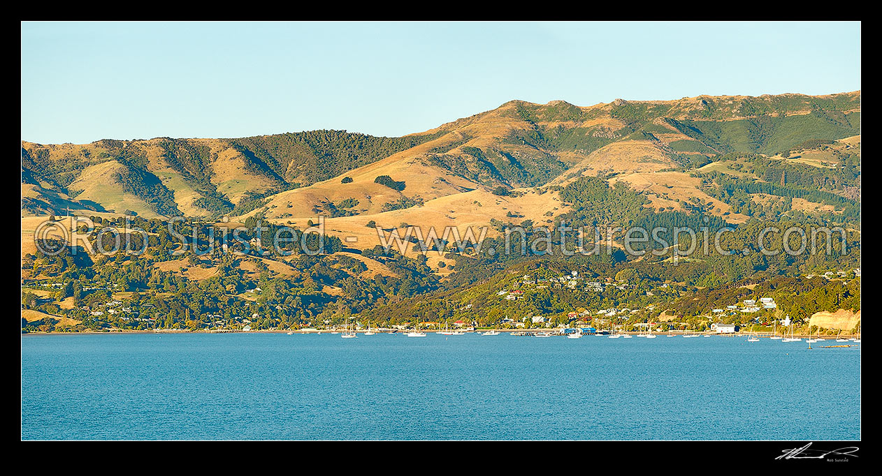 Image of Akaroa township seen from the harbour. Banks Peninsula. Panorama, Akaroa, Christchurch City District, Canterbury Region, New Zealand (NZ) stock photo image