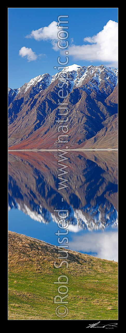 Image of Lake Hawea on a perfect calm spring/winter day reflecting the surrounding snowy ranges. Vertical panorama, Lake Hawea, Otago, Queenstown Lakes District, Otago Region, New Zealand (NZ) stock photo image