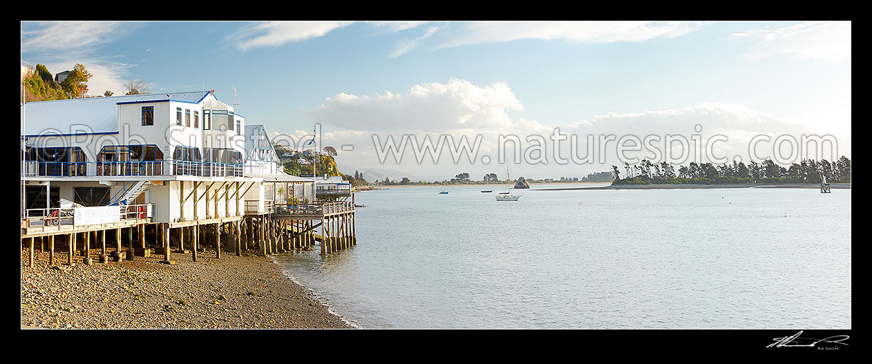 Image of Nelson waterfront with Yacht Club, The Boathouse and Boat shed restaurants. Haulashore Island right and Tahunanui beach beyond. Panorama, Nelson, Nelson City District, Nelson Region, New Zealand (NZ) stock photo image