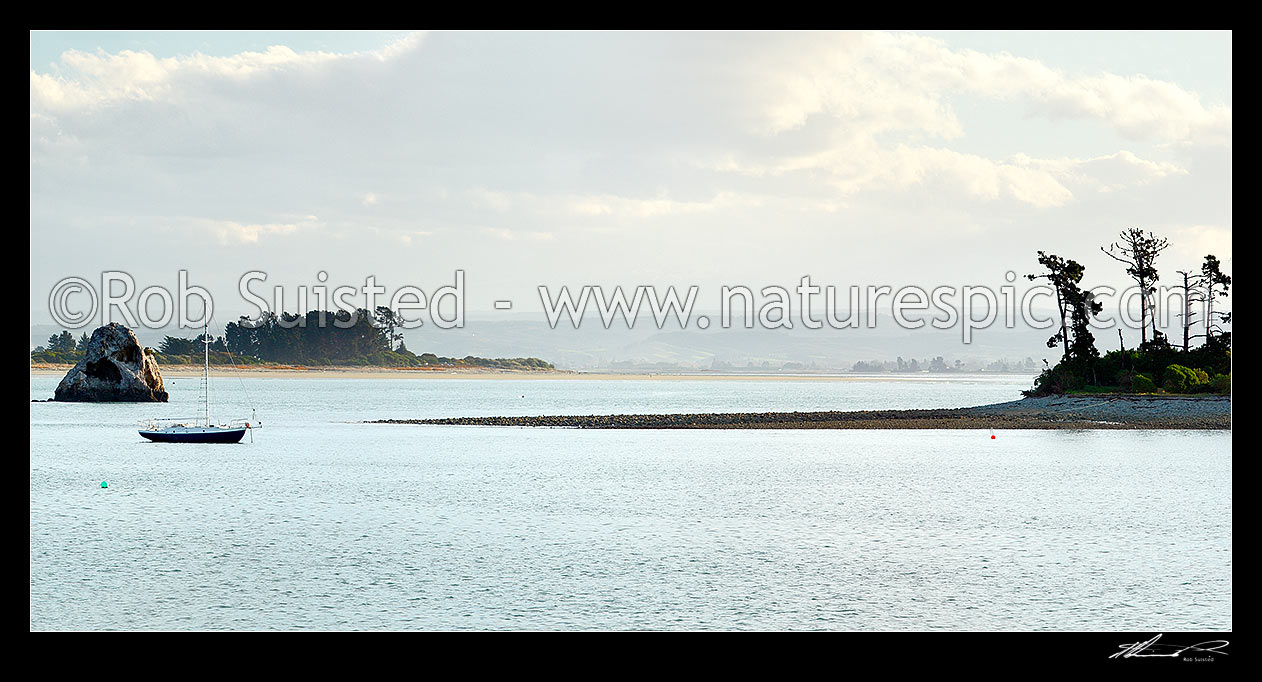 Image of Yacht moored in Nelson harbour with Haulashore Island at right, and Tahunanui Beach behind. Panorama, Nelson, Nelson City District, Nelson Region, New Zealand (NZ) stock photo image