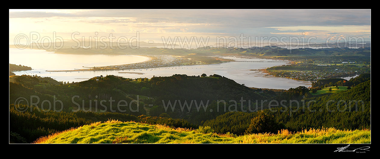 Image of Omaha Beach and Whangateau Harbour at dawn, with Ti Point and Kawau Island far left. Point Wells far right. Panorama, Leigh, Rodney District, Auckland Region, New Zealand (NZ) stock photo image