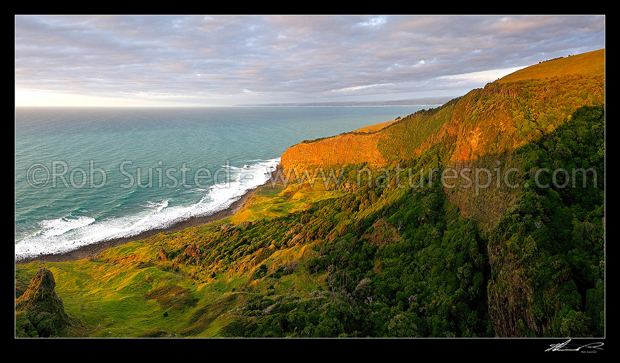 Image of Te Toko Gorge natural coastal amphitheatre with the Raglan coast beyond. Evening sunset panorama, Raglan, Waikato District, Waikato Region, New Zealand (NZ) stock photo image