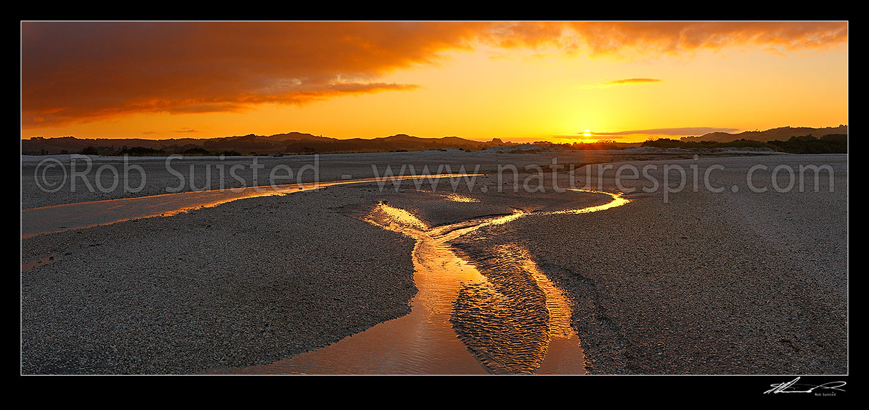 Image of Sunset over shellbanks and stream on the Hauraki Gulf coast near Miranda. Panorama, Kaiaua, Franklin District, Waikato Region, New Zealand (NZ) stock photo image