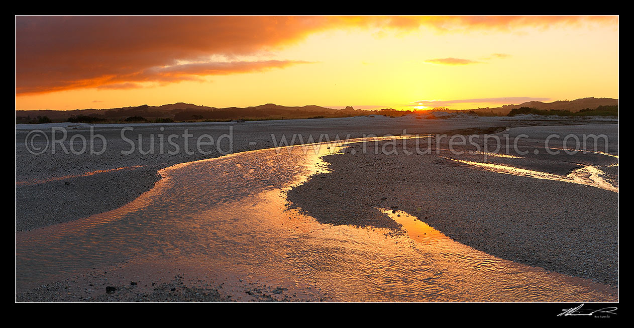 Image of Sunset over shellbanks and stream on the Hauraki Gulf coast near Miranda. Panorama, Kaiaua, Franklin District, Waikato Region, New Zealand (NZ) stock photo image