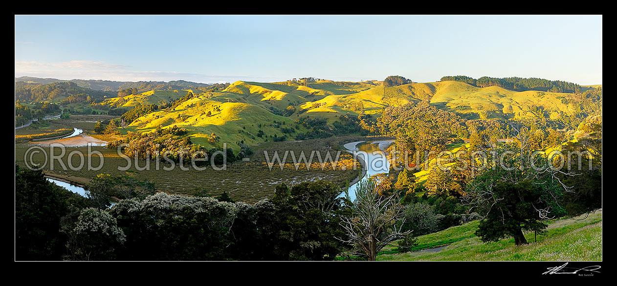 Image of Puhoi river valley winding through farmland near Waiwera. Panorama, Puhoi, Rodney District, Auckland Region, New Zealand (NZ) stock photo image