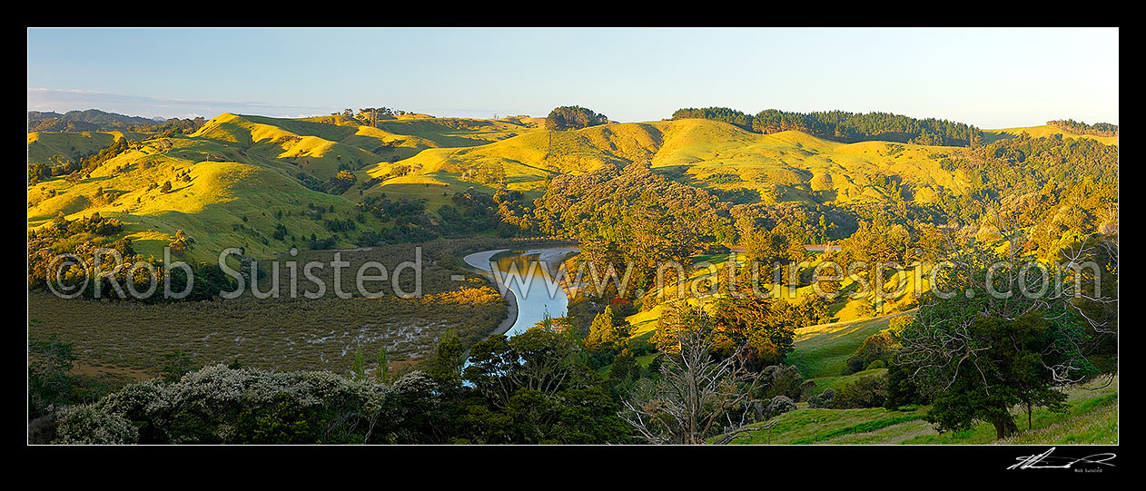 Image of Puhoi river valley winding through farmland near Waiwera. Panorama, Puhoi, Rodney District, Auckland Region, New Zealand (NZ) stock photo image