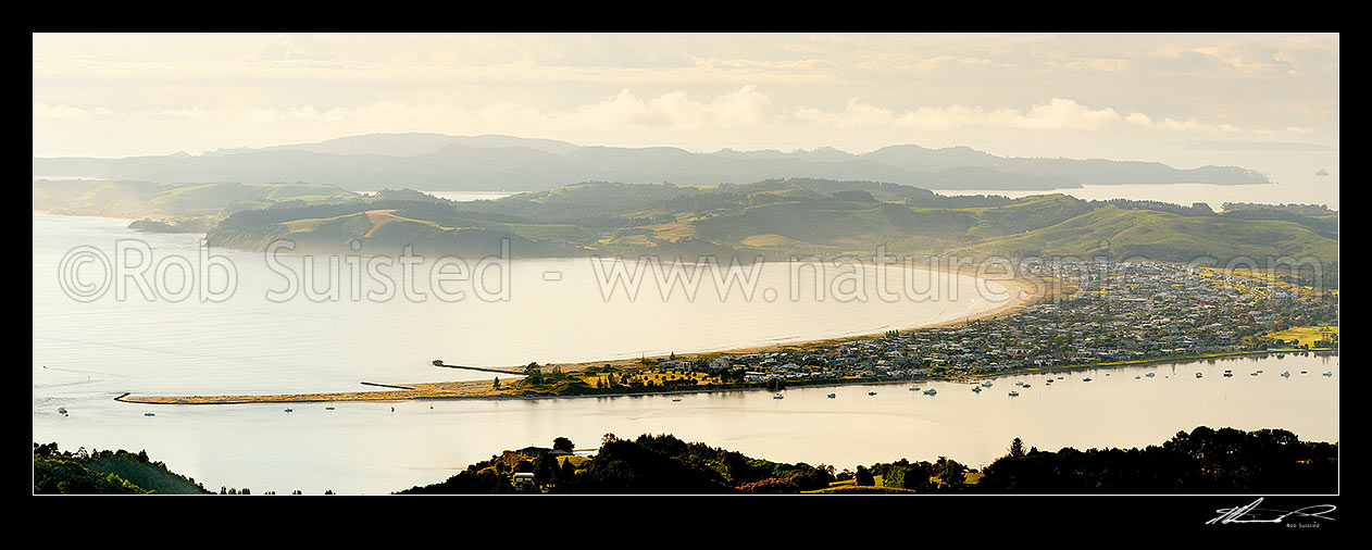 Image of Omaha Beach, Bay and Whangateau Harbour entrance, with Tawharanui Peninsula and Kawau Island beyond, at dawn. Panorama, Omaha, Rodney District, Auckland Region, New Zealand (NZ) stock photo image