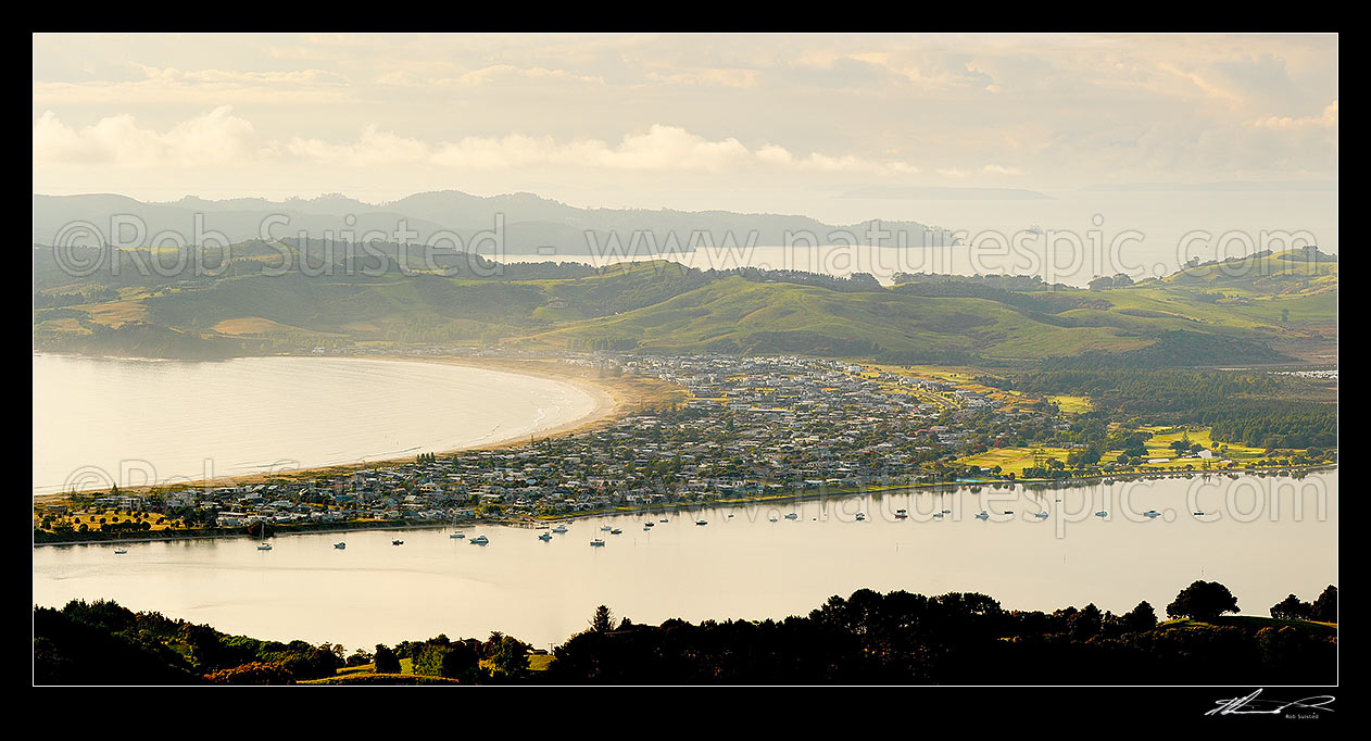 Image of Omaha Beach, Bay, and Whangateau Harbour, with Tawharanui Peninsula and Kawau Island beyond, at dawn. Panorama, Omaha, Rodney District, Auckland Region, New Zealand (NZ) stock photo image