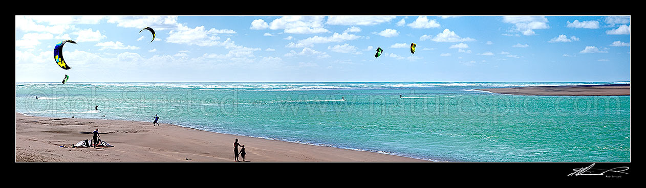 Image of Kite surfers surfing at Wainamu Beach and the Raglan Bar and Raglan Harbour entrance. Panorama, Raglan, Waikato District, Waikato Region, New Zealand (NZ) stock photo image