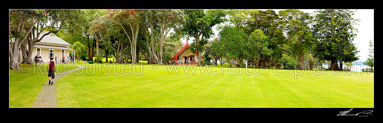 Image of The Treaty House (1834 - left) and Te Whare Runanga (1940 - centre) at the Waitangi Treaty Grounds. Te Tiriti o Waitangi. Panorama, Paihia, Bay of Islands, Far North District, Northland Region, New Zealand (NZ) stock photo image