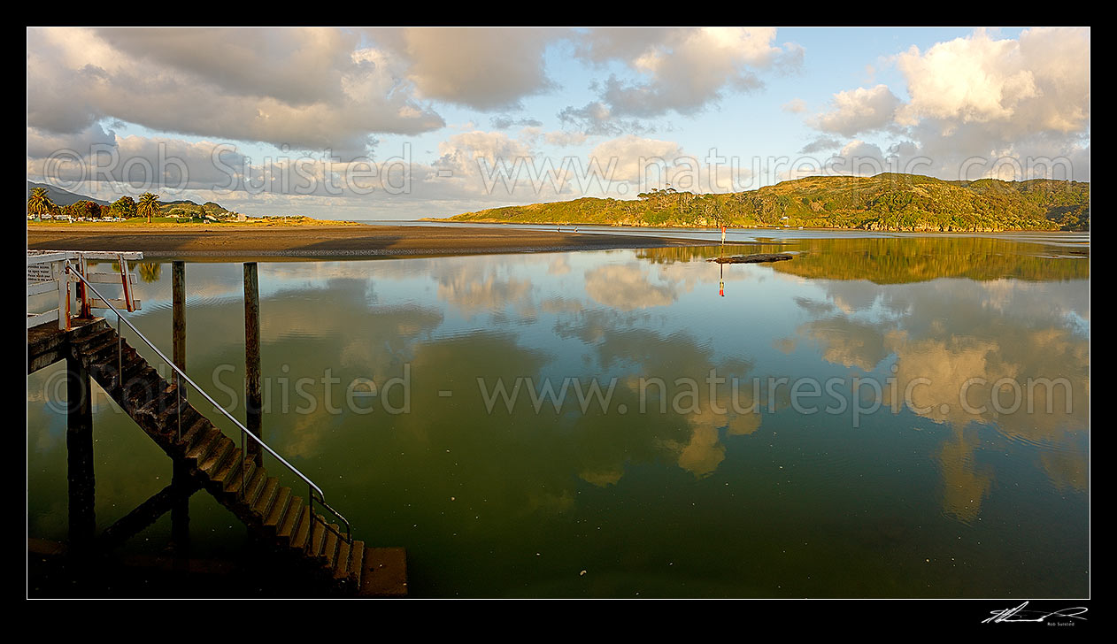 Image of Raglan, with Putoetoe Point (centre), the Raglan harbour entrance and bar (left), and Rangitoto Point behind. Panorama, Raglan, Waikato District, Waikato Region, New Zealand (NZ) stock photo image