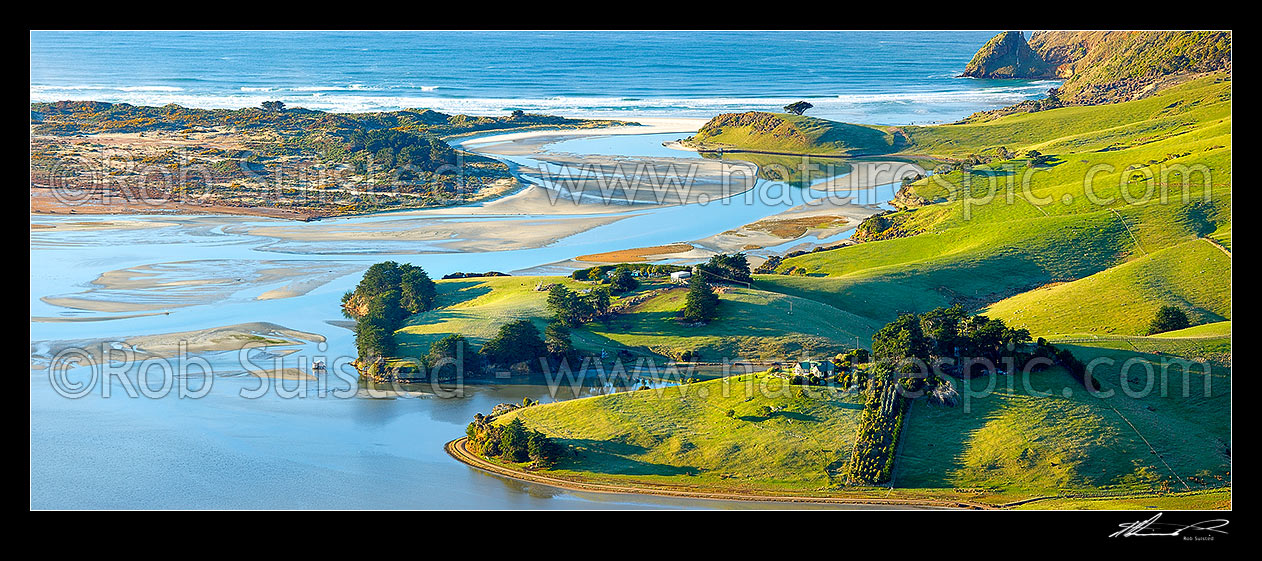 Image of Otago Peninsula farmland, houses and beaches around Hoopers Inlet mouth on a perfect calm later winter morning. Allans Beach left. Panorama, Otago Peninsula, Dunedin City District, Otago Region, New Zealand (NZ) stock photo image