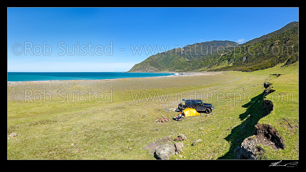 Image of Tent camping in Palliser Bay, Remutaka (Rimutaka) Forest Park (The Peak 864m above Windy Point) near Mukamuka River mouth. Panorama, Palliser Bay, South Wairarapa District, Wellington Region, New Zealand (NZ) stock photo image