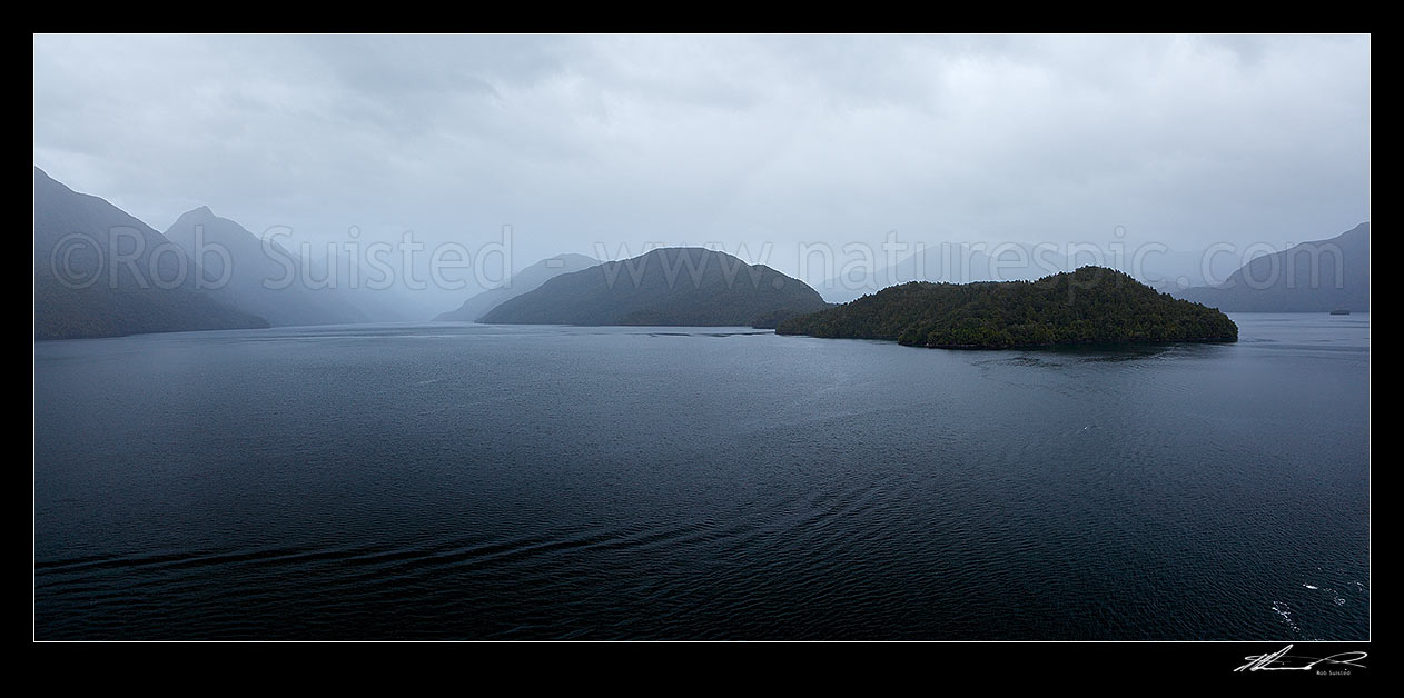 Image of Dusky Sound, looking down Cook Channel with Long Island, East Point and Paget Passage at right. Mt Evans (1084m) at left. Panorama, Dusky Sound, Fiordland National Park, Southland District, Southland Region, New Zealand (NZ) stock photo image