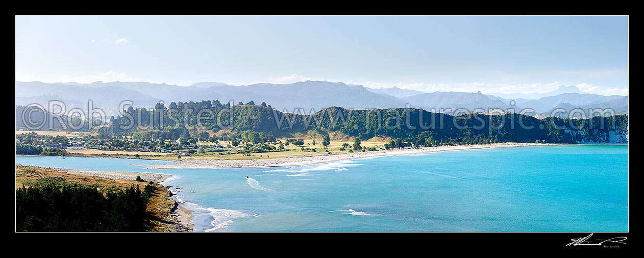 Image of Tolaga Bay and the Uawa River mouth. Mt Hikurangi (1752m) distant far right. Panorama, Tolaga Bay, Gisborne District, Gisborne Region, New Zealand (NZ) stock photo image