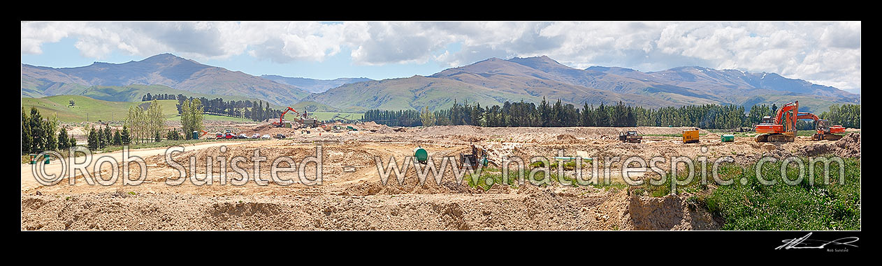 Image of Gold mining at Drybread Diggings with excavators and alluvial gold screens. Panorama, Drybread, Central Otago District, Otago Region, New Zealand (NZ) stock photo image