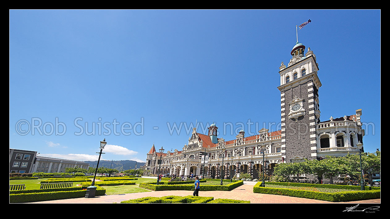 Image of Historic Dunedin Railway Station, opened in 1906, built in an eclectic, revived Flemish renaissance style. Panorama, Dunedin, Dunedin City District, Otago Region, New Zealand (NZ) stock photo image