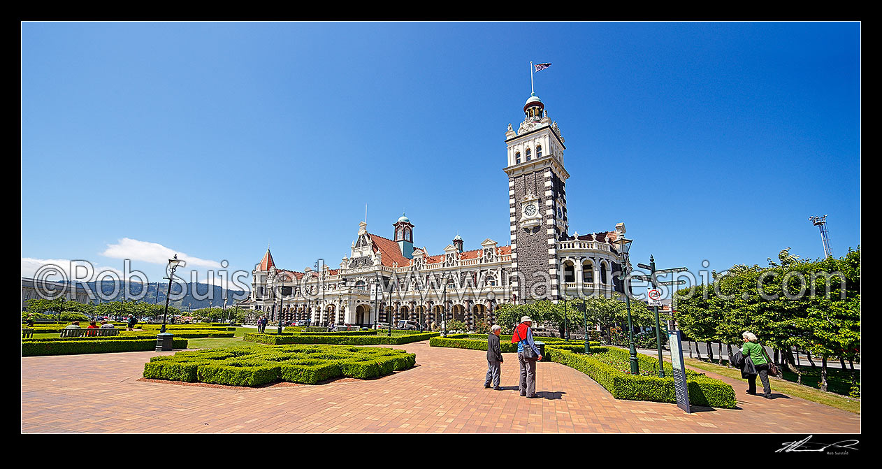 Image of Historic Dunedin Railway Station, opened in 1906, built in an eclectic, revived Flemish renaissance style. Panorama, Dunedin, Dunedin City District, Otago Region, New Zealand (NZ) stock photo image