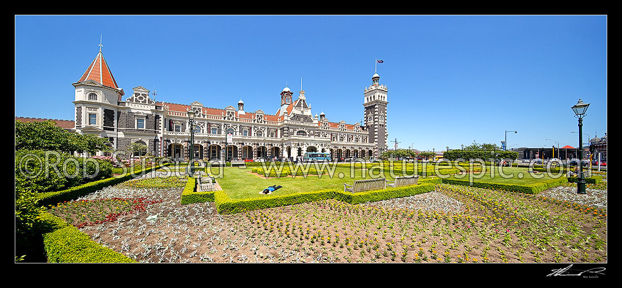 Image of Historic Dunedin Railway Station, opened in 1906, built in an eclectic, revived Flemish renaissance style. Panorama, Dunedin, Dunedin City District, Otago Region, New Zealand (NZ) stock photo image