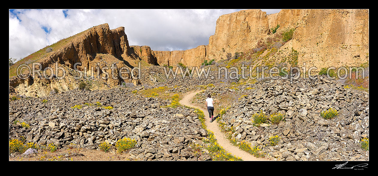 Image of Bannockburn Sluicings Historic Reserve walkway with remains of gold mining and sluicing over 50 years from the early 1860s. Panorama, Bannockburn, Central Otago District, Otago Region, New Zealand (NZ) stock photo image