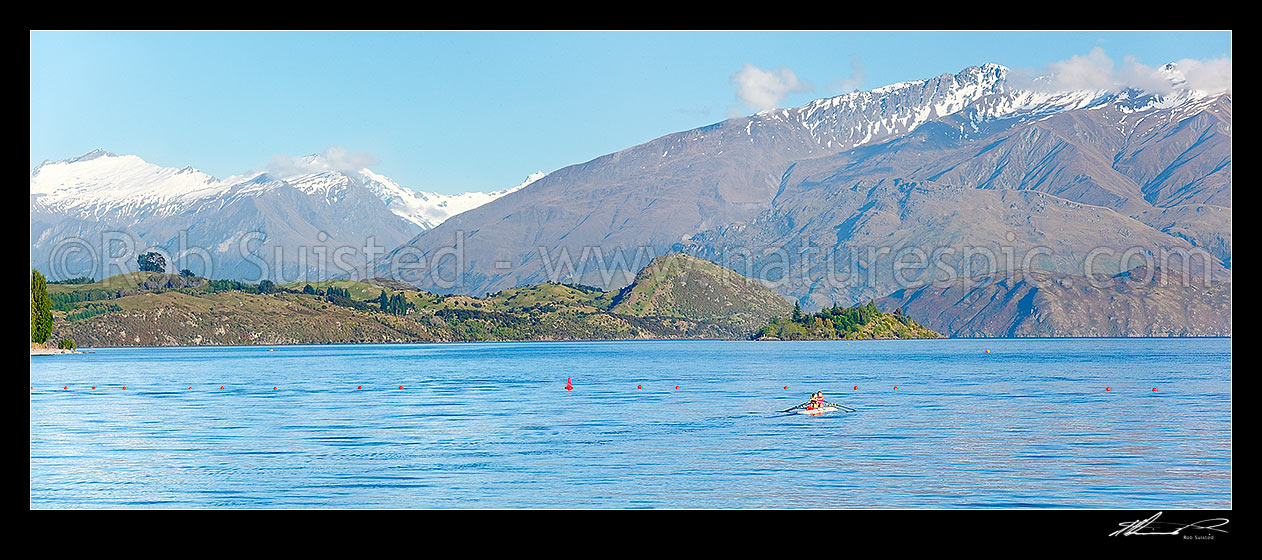 Image of Lake Wanaka rowing double or pair practising. Mount Aspiring National Park beyond. Panorama, Wanaka, Queenstown Lakes District, Otago Region, New Zealand (NZ) stock photo image