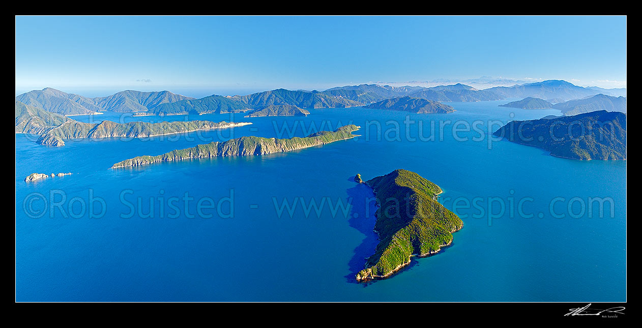 Image of Outer Marlborough Sounds in Queen Charlotte Sound (Totaranui). Motuara Island centre right, Long Island centre, with Pickersgill and Blumine Islands behind. Arapawa Island left. Kaikoura Ranges distant right. Panorama, Marlborough Sounds, Marlborough District, Marlborough Region, New Zealand (NZ) stock photo image