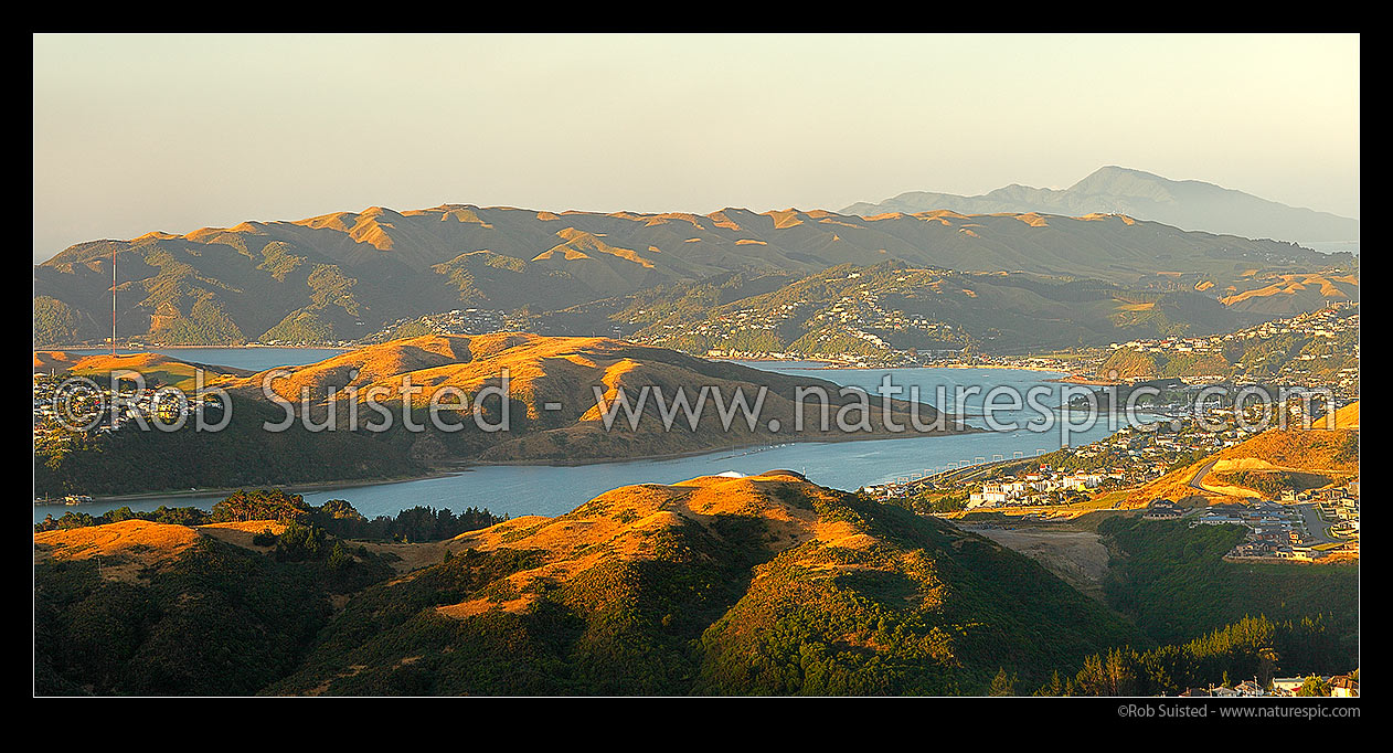 Image of Porirua City and Harbour. Titahi Bay left, Papakowhai and Paremata at right. Plimmerton and Kapiti Island in distance. Panorama, Porirua, Porirua City District, Wellington Region, New Zealand (NZ) stock photo image