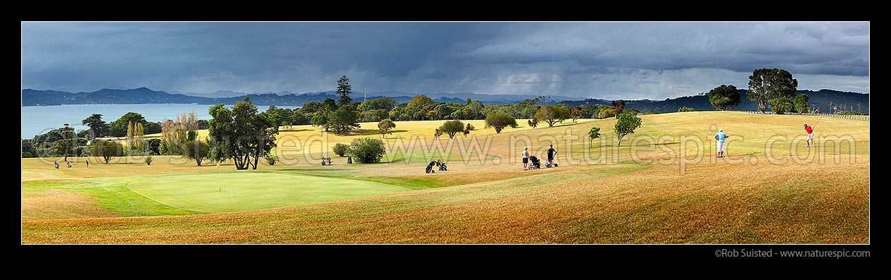 Image of Waitangi Golf Club over looking the Bay of Islands towards Russell. Panorama, Pahia, Bay of Islands, Far North District, Northland Region, New Zealand (NZ) stock photo image