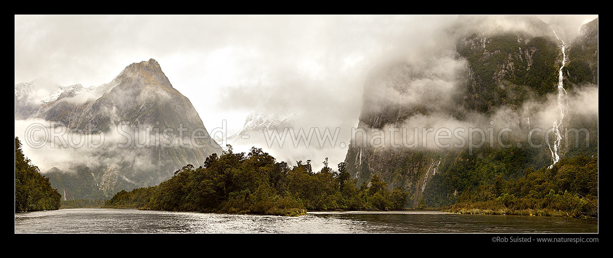 Image of Moody Milford Sound. Arthur River looking toward Barren Peak (1561m left), Darran Mountains & Cleddau Valley (centre), and Sheerdown Hills (right). Panorama, Milford Sound, Fiordland National Park, Southland District, Southland Region, New Zealand (NZ) stock photo image