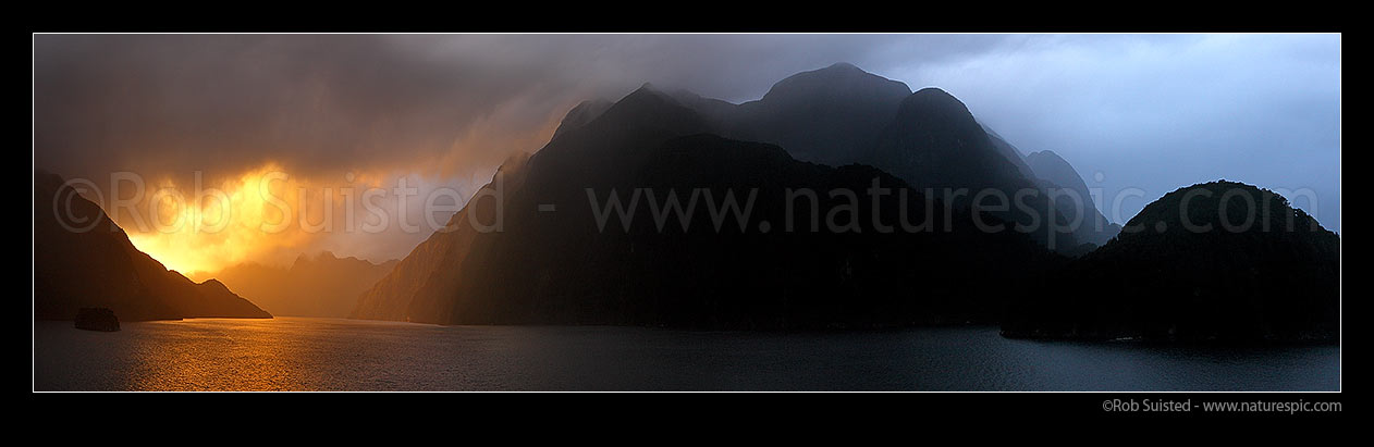 Image of Acheron Passage stormy sunset, looking towards Breaksea Sound (left), Wet Jacket Arm at right. Resolution Island far left. Panorama, Breaksea Sound, Fiordland National Park, Southland District, Southland Region, New Zealand (NZ) stock photo image