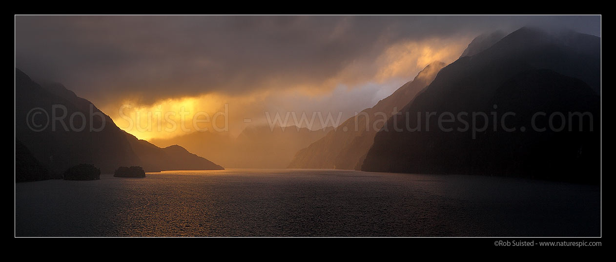 Image of Acheron Passage stormy sunset, looking towards Breaksea Sound. Resolution Island left. Panorama, Breaksea Sound, Fiordland National Park, Southland District, Southland Region, New Zealand (NZ) stock photo image