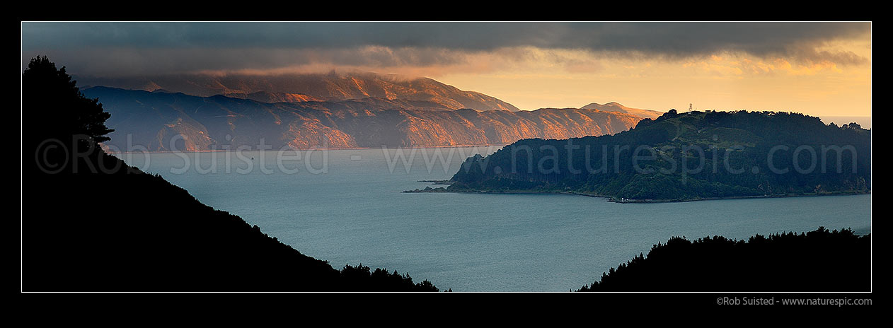 Image of Breaking weather over Wellington Harbour. Post southerly storm sunlight lighting Pencarrow Head and Eastbourne Coast. Point Halswell left. Panorama, Wellington Harbour, Wellington City District, Wellington Region, New Zealand (NZ) stock photo image