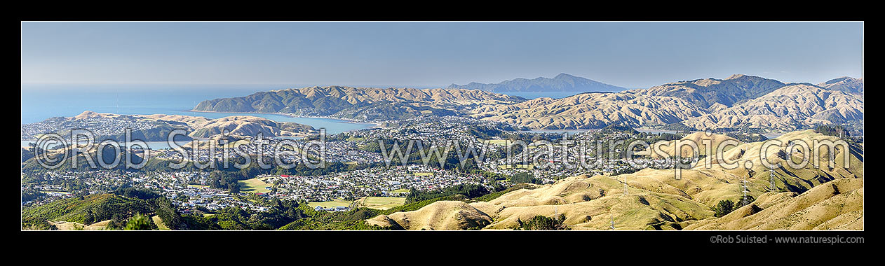 Image of Porirua City panorama. Cannons Creek, Porirua East, Aotea, Paremata, Plimmerton, Whitby, Pauatahanui Inlet, with Kapiti Island distant. From Belmont Regional Park, Porirua, Porirua City District, Wellington Region, New Zealand (NZ) stock photo image